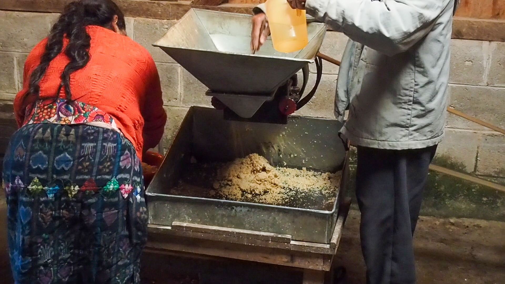 Chiri’j Ximay; soaked corn for tortillas being grounded in the village mill